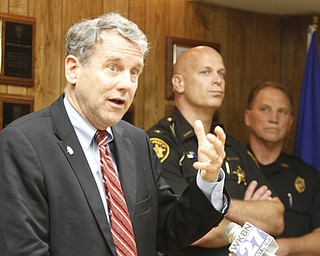        ROBERT K. YOSAY  | THE VINDICATOR..U.S. Sen. Sherrod Brown, a Democrat of Cleveland, met with local law enforcement today to discuss the importance of federal funds to maintain safety..The Byrne Justice Assistance Grant (Byrne JAG) program has provided more than $15 million to help Ohio police departments.-those in attendance - Brown at mike- - Sheriff Jerry Greene- Robert Cavalier - APD- .