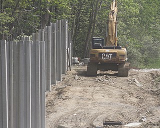        ROBERT K. YOSAY  | THE VINDICATOR.. Lake Milton traffic noise barrier wall under construction.on Interstate 76 eastbound and westbound on both sides of Lake Milton is under construction with the main posts that will hold the sections of wall..