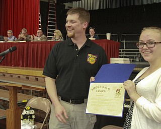 William d Lewis the Vindicator  Sarah Pavalko, a Boardman 9th grader is presented an award from Ken Klouda of the State Fire Marshall office during a special meeting of the Boardman Twp.Trustees at Boardman Center Middle School 5-11-15. Sarah discovered a fire in her home and call fire department last year.  She was also awarded a proclamation from trustees.