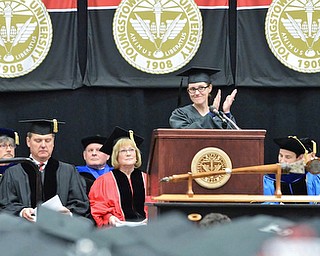 Jeff Lange | The Vindicator  MAY 16, 2015 - Melanie Shipman applauds the other graduates during her student reflection speech at Saturday morning's commencement ceremony at the Beeghly Center in Youngstown.