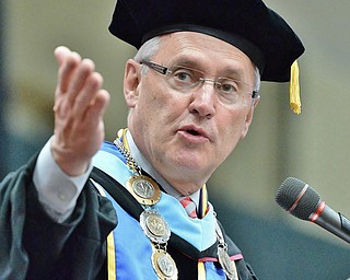 Jeff Lange | The Vindicator  MAY 16, 2015 - Youngstown State University President Jim Tressel recognizes the veterans in the crowd during Saturday morning's commencement ceremony in the Beeghly Center.