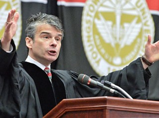 Jeff Lange | The Vindicator  MAY 16, 2015 - Randall Craig Fleischer, music director of the Youngstown Symphony Orchestra delivers his commencement address during Saturday afternoon's commencement ceremony at YSU.
