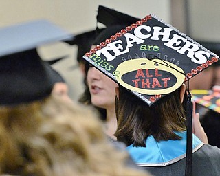 Jeff Lange | The Vindicator  MAY 16, 2015 - Melissa Charles of Liberty sports a customized graduation cap for Youngstown's commencement ceremony at the Beeghly Center, Saturday morning.