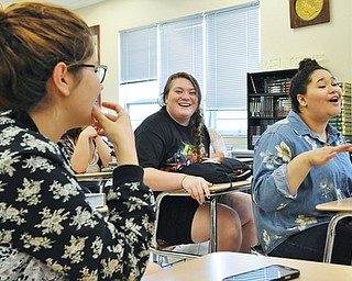 Jeff Lange | The Vindicator  MAY 11, 2015 - Adelina Buga (left), Connie Cross (center) and Tatiana Ludt all laugh as they recall making the video with their classmates, Monday afternoon at West Branch High School.