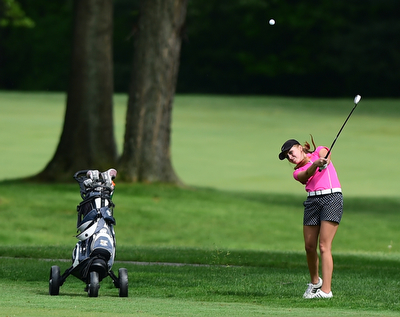 VIENNA, OHIO - MAY 17, 2015: Taylor Vassis of Vienna follows through on her approach shot on the 13th hole Sunday afternoon at Squaw Creek Country Club during the Vindy Greatest Golfer junior qualifier. (Photo by David Dermer/Youngstown Vindicator)