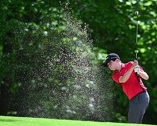 VIENNA, OHIO - MAY 17, 2015: Michael Butch chips out of the bunker and onto the green on the 13th hole Sunday afternoon at Squaw Creek Country Club during the Vindy Greatest Golfer junior qualifier. (Photo by David Dermer/Youngstown Vindicator)