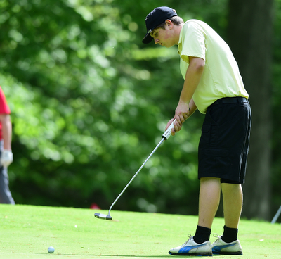 VIENNA, OHIO - MAY 17, 2015: Jacob Dubravcak follows through on his putt on the 13th hole Sunday afternoon at Squaw Creek Country Club during the Vindy Greatest Golfer junior qualifier. (Photo by David Dermer/Youngstown Vindicator)