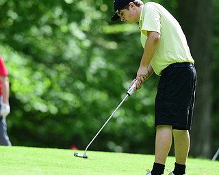 VIENNA, OHIO - MAY 17, 2015: Jacob Dubravcak follows through on his putt on the 13th hole Sunday afternoon at Squaw Creek Country Club during the Vindy Greatest Golfer junior qualifier. (Photo by David Dermer/Youngstown Vindicator)