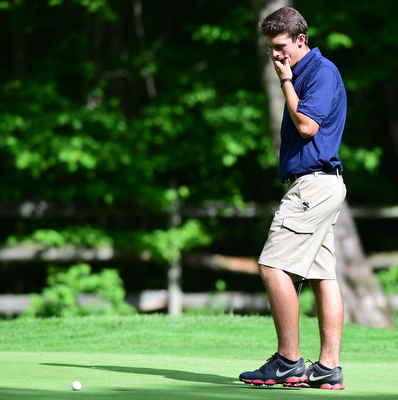 VIENNA, OHIO - MAY 17, 2015: Dylan Todd reacts after his golf ball rolled off the lip of the hole and back onto the green on the 14th hole Sunday afternoon at Squaw Creek Country Club during the Vindy Greatest Golfer junior qualifier. (Photo by David Dermer/Youngstown Vindicator)