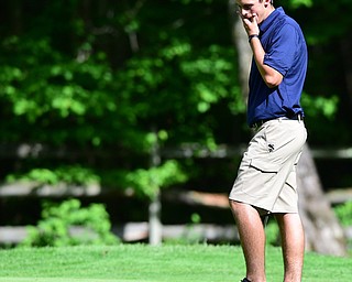 VIENNA, OHIO - MAY 17, 2015: Dylan Todd reacts after his golf ball rolled off the lip of the hole and back onto the green on the 14th hole Sunday afternoon at Squaw Creek Country Club during the Vindy Greatest Golfer junior qualifier. (Photo by David Dermer/Youngstown Vindicator)
