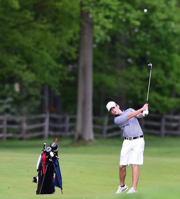 VIENNA, OHIO - MAY 17, 2015: Brian Velasquez of Poland follows through on his approach shot on the 16th hole Sunday afternoon at Squaw Creek Country Club during the Vindy Greatest Golfer junior qualifier. (Photo by David Dermer/Youngstown Vindicator)
