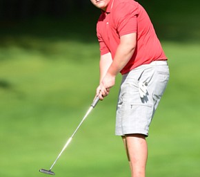 VIENNA, OHIO - MAY 17, 2015: Joey Shushok of Austintown watches as his putt breaks toward the hole on the 17th hole Sunday afternoon at Squaw Creek Country Club during the Vindy Greatest Golfer junior qualifier. (Photo by David Dermer/Youngstown Vindicator)