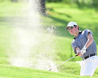 VIENNA, OHIO - MAY 17, 2015: Brian Velasquez of Poland chips out of the bunker and onto the green on the 18th hole Sunday afternoon at Squaw Creek Country Club during the Vindy Greatest Golfer junior qualifier. (Photo by David Dermer/Youngstown Vindicator)