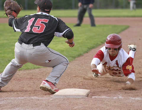 William D. Lewis the Vindicator Mooney's Trent Humphreys(21) dives back to first ahead of the throw while Canfield 1rst basebman Pete Hernandez(15) waits for the throw during 5/20/15 win over Mooney atCene.