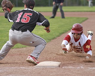 William D. Lewis the Vindicator Mooney's Trent Humphreys(21) dives back to first ahead of the throw while Canfield 1rst basebman Pete Hernandez(15) waits for the throw during 5/20/15 win over Mooney atCene.