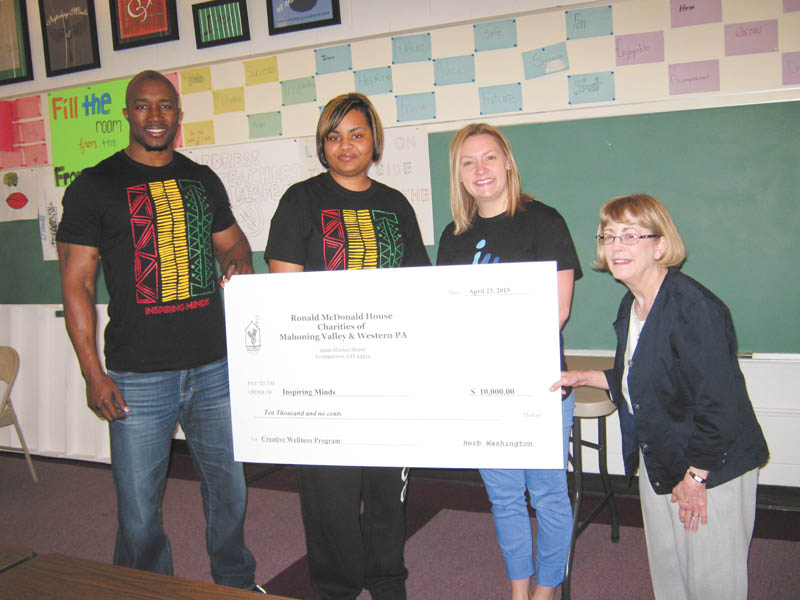 SPECIAL TO THE VINDICATOR
Ronald McDonald House Charities of Mahoning Valley and Western Pa. recently granted $10,000 to Inspiring Minds for its After School/Summer Enrichment Program. The presentation took place at Inspiring Minds, 175 Laird Ave. NE, Warren. From left are Deryck Toles, executive director; Renda White, kindergarten through eighth grade program coordinator; and Jessica Winters, program administrator, all of Inspiring Minds; and Sheila Williams, coordinator at RMHC of Mahoning Valley and Western Pa.