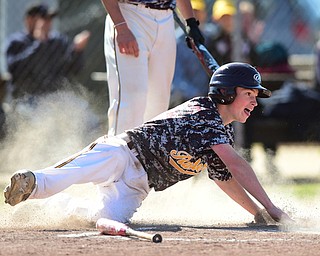 STRUTHERS, OHIO - MAY 22, 2015: Jack Bajerski #21 of South Range slides across home plate to score a run in the top of the 1st inning during Friday evenings game at Cene Park. Ursuline won 13-3. (Photo by David Dermer/Youngstown Vindicator)