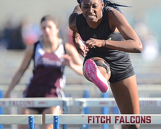 Jeff Lange | The Vindicator  MAY 22, 2015 - Aisha Jackson of Harding jumps the final hurdle during the women's 100 meter hurdles event during the DI district track meet at Fitch HS. Jackson finished first in the event with a time of 14.57 seconds.