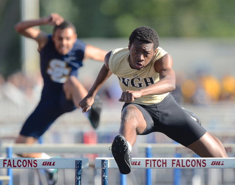 Jeff Lange | The Vindicator  MAY 22, 2015 - Warren Harding's Jermanie Jones jumps the final hurdle in Friday's 110 meter hurdle event during the DI district track meet at Austintown HS. Jones finished first with a time of 15.4 seconds.