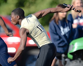 Jeff Lange | The Vindicator  MAY 22, 2015 - Harding's Justin May takes the handoff from Qua'Damaun Jones during the men's 4x200 meter relay at Fitch HS during the DI district track meet.