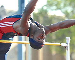 Jeff Lange | The Vindicator  Fitch's Carlos Herriott keeps his eye on the bar as he attempts to jump 6' 2" in the men's high jump event during Friday's DI district track meet at Austintown Fitch HS. Harriott took first place with his jump of 6' 2".