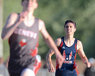 Jeff Lange | The Vindicator  MAY 22, 2015 - Fitch's Anthony Linert (right) attempts to catch up with a Geneva competitor in the men's 800 meter run during Friday's DI district track meet at Fitch HS. Linert finished seventh with a time of 2:00.61.