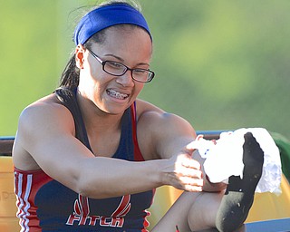 Jeff Lange | The Vindicator  MAY 22, 2015 - Austintown Fitch's Ebony Davis ices her foot after finishing fourth in the women's 200 meter dash with a time of 26.42 seconds during Friday afternoon's DI district track meet at Austintown Fitch High School.