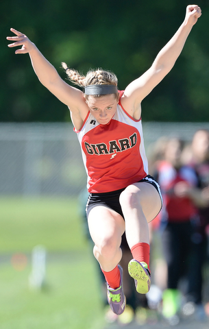 Jeff Lange | The Vindicator  MAY 23, 2015 - Girard senior Brandi Shonce leaps through the air in the girls long jump competition during Saturday's DII district meet at Lakeview High School. Shonce captured first place in long jump for Girard with a winning jump of 16 feet.