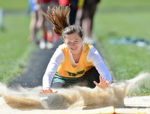 Jeff Lange | The Vindicator  MAY 23, 2015 - Ursuline sophomore Kristen Henderson lands in the pit after jumping 13 feet 2 inches during Saturday's DII district finals meet at Lakeview High School.