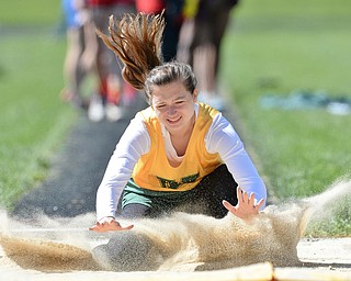 Jeff Lange | The Vindicator  MAY 23, 2015 - Ursuline sophomore Kristen Henderson lands in the pit after jumping 13 feet 2 inches during Saturday's DII district finals meet at Lakeview High School.