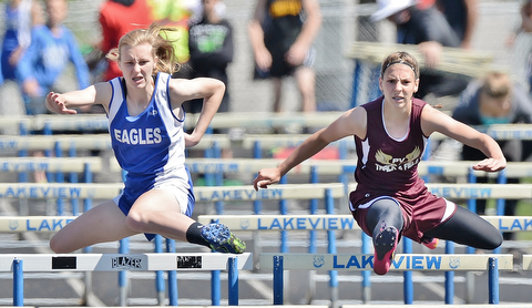 Jeff Lange | The Vindicator  MAY 23, 2015 - Hubbard sophomore Justine Wylie (left) races to the finish against Pymatuning Valley's Mackenzie Inman in the girls 100 meter hurdle event at the DII district track finals at Lakeview High School, Saturday.