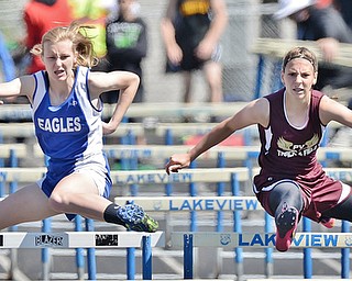 Jeff Lange | The Vindicator  MAY 23, 2015 - Hubbard sophomore Justine Wylie (left) races to the finish against Pymatuning Valley's Mackenzie Inman in the girls 100 meter hurdle event at the DII district track finals at Lakeview High School, Saturday.