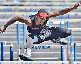 Jeff Lange | The Vindicator  MAY 23, 2015 - Girard's Collin Harden competes in the boys 110 meter hurdle event during Saturday's DII district track finals at Lakeview High School. Harden placed third in the event with a time of 15.68 seconds.