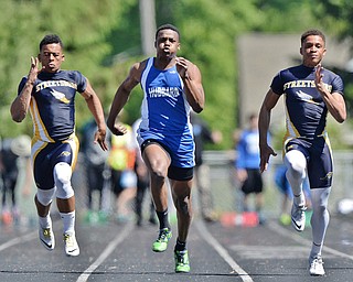 Jeff Lange | The Vindicator  MAY 23, 2015 - Hubbard's George Hill (center) competes in the boys 100 meter dash against Streetsboro's Prince Franklin (left) and Dakar Carter (right) during Saturday's DII district track finals at Lakeview High School. Hubbard's Hill placed second with a time of 11.06 seconds.