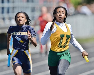 Jeff Lange | The Vindicator  MAY 23, 2015 - Alexandra Carnathan sprints ahead of Streetsboro's Jayana Taylor in the girls 4x200 meter relay during Saturday's DII district track finals at Lakeview High School.