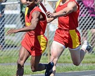 Jeff Lange | The Vindicator  MAY 23, 2015 - Mooney's Syied Bowers (left) takes the handoff from Luke Pecchia during the boys 4x200 meter relay at the DII district finals at Lakeview High School, Saturday. Mooney's 4x200 team placed fourth in the event with a time of 1:34.38.