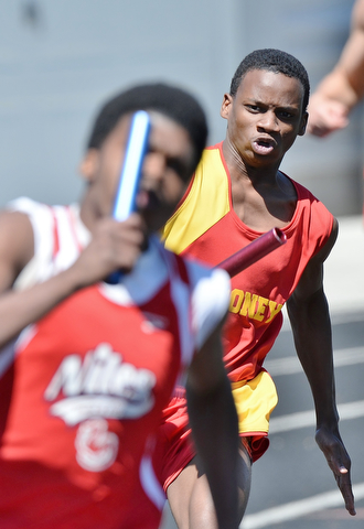 Jeff Lange | The Vindicator  MAY 23, 2015 - Mooney's Syied Bowers (right) competes in the boys 4x200 meter relay during Saturday's DII district finals meet at Lakeview High School.