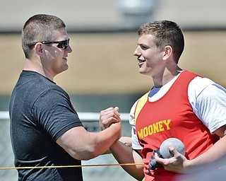 Jeff Lange | The Vindicator  MAY 23, 2015 - Mooney senior Dante Penza (right) is congratulated after his stadium record breaking throw of 58 feet 9.75 inches by his personal throwing coach and former stadium record holder Nick Panezich of Springfield. Panezich set the record in 2004 with a throw of 57 feet 7.75 inches.