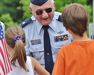 Jeff Lange | The Vindicator  MAY 25, 2015 - Lt. Col. Bill Moss (center) shakes the hands of young children after Monday's Memorial Day ceremony at Boardman Park.
