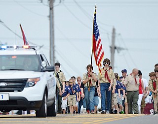 Jeff Lange | The Vindicator  MAY 25, 2015 - Boy Scout Troop 46 leads the parade down U.S. 224 during Monday's Memorial Day Parade in Boardman.