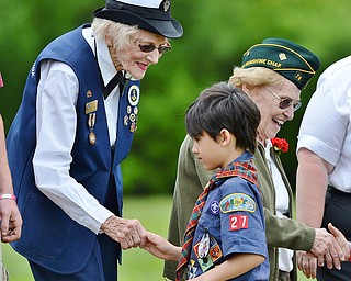 Jeff Lange | The Vindicator  MAY 25, 2015 - United States Navy Veteran of 1943-1946 Store Keeper First Class Betty Harris and Private First Class Florence Pearl shake the hands of young Boy Scouts, Monday afternoon at Boardman Park after the Memorial Day Ceremony.