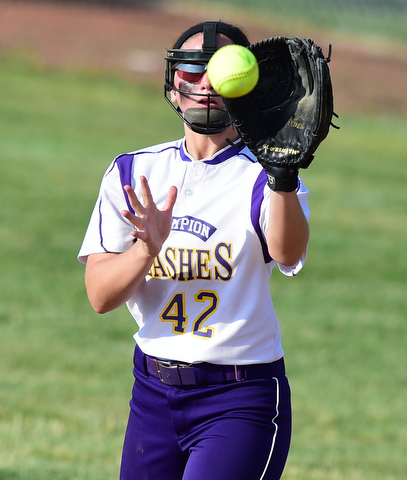 MASSILLON, OHIO - MAY 27, 2015: Infielder Amber Ricci #42 of Champion looks the ball into her glow for the out in the top of the 5th inning during Wednesday nights Regional Semi-Final game at Massillon High School. Champion won 6-5 in 9 innings. (Photo by David Dermer/Youngstown Vindicator)