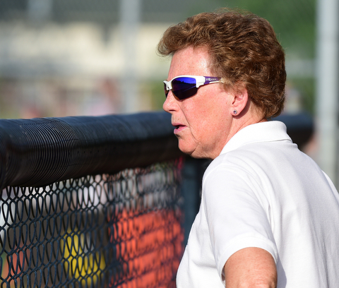 MASSILLON, OHIO - MAY 27, 2015: Head coach Cheryl Weaver of Champion stands in the dugout in the top of the 5th inning during Wednesday nights Regional Semi-Final game at Massillon High School. Champion won 6-5 in 9 innings. (Photo by David Dermer/Youngstown Vindicator)