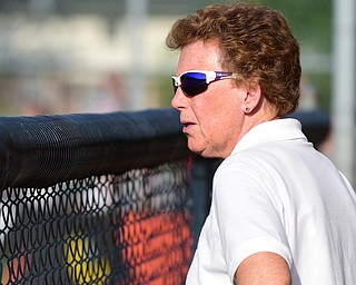 MASSILLON, OHIO - MAY 27, 2015: Head coach Cheryl Weaver of Champion stands in the dugout in the top of the 5th inning during Wednesday nights Regional Semi-Final game at Massillon High School. Champion won 6-5 in 9 innings. (Photo by David Dermer/Youngstown Vindicator)