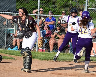 MASSILLON, OHIO - MAY 27, 2015: Mackenzie Zigmont #3 of Champion leaps while teammate Amber Ricci #42 steps on home plate to tie the game at 5 in the bottom of the 7th inning during Wednesday nights Regional Semi-Final game at Massillon High School. Champion won 6-5 in 9 innings. (Photo by David Dermer/Youngstown Vindicator) Waynedale Karmen Huntsberger #14 pictured.
