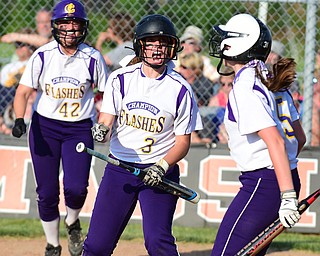 MASSILLON, OHIO - MAY 27, 2015: Mackenzie Zigmont #3 of Champion celebrates with teammates Amber Ricci #42 & Molly Williams #5 after Champion tied the game at 5 in the bottom of the 7th inning during Wednesday nights Regional Semi-Final game at Massillon High School. Champion won 6-5 in 9 innings. (Photo by David Dermer/Youngstown Vindicator)