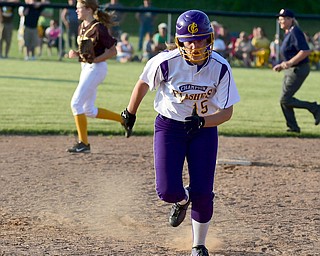MASSILLON, OHIO - MAY 27, 2015: Base runner Megan Turner #15 of Champion sprints to third base to head home and score the game winning run in the bottom of the 9th inning during Wednesday nights Regional Semi-Final game at Massillon High School. Champion won 6-5 in 9 innings. (Photo by David Dermer/Youngstown Vindicator)