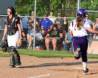MASSILLON, OHIO - MAY 27, 2015: Catcher Karmen Huntsberger #14 of Waynedale looks away as base runner Megan Turner #15 of Champion sprints home to score the game winning run in the bottom of the 9th inning during Wednesday nights Regional Semi-Final game at Massillon High School. Champion won 6-5 in 9 innings. (Photo by David Dermer/Youngstown Vindicator)