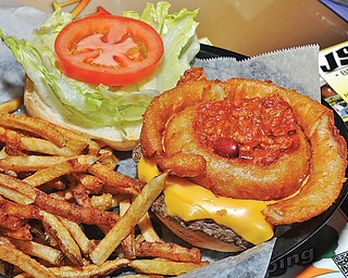 Leon’s Deluxe Burger, a burger with chili, onion rings, lettuce, tomato and cheese available at Leon’s Sports Bar and Grille.