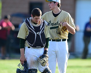 MASSILLON, OHIO - MAY 28, 2015: Pitcher Vinnie Lucent #11 and Drew Potesta #3 of Ursuline react near the pitchers mound after 2 Manchester runs scored int he top of the 7th inning during Thursday nights game at Massillon High School. (Photo by David Dermer/Youngstown Vindicator)